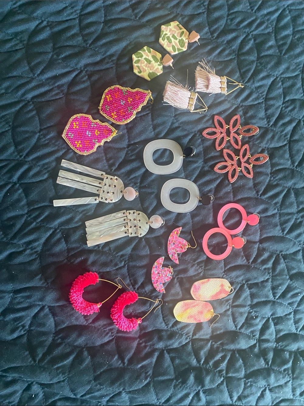 10 Pair of various pink earrings. Light pink, fluorescent pink, dark pink.